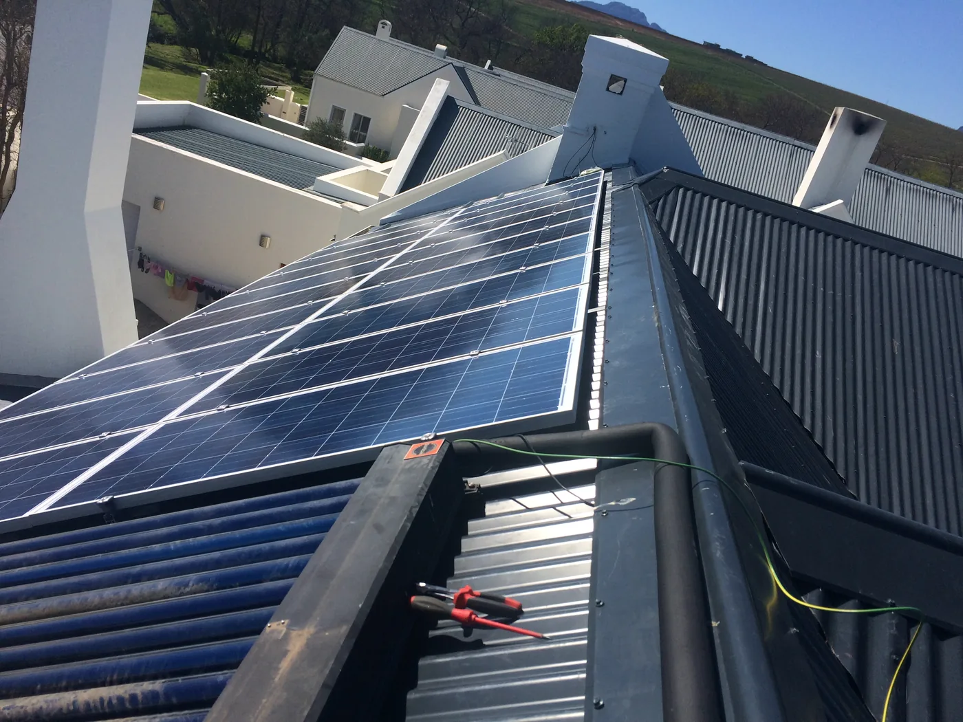 Aerial view of a completed residential solar installation